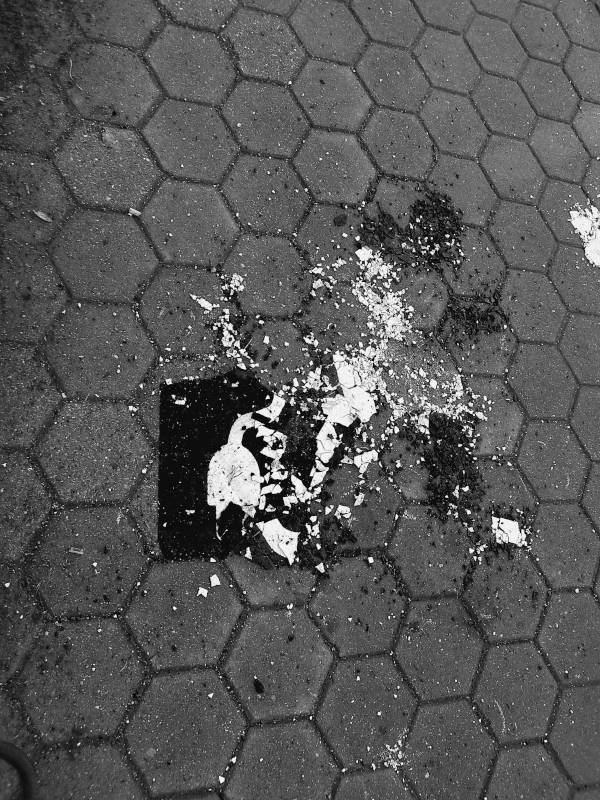crushed street painted sign for e-mobility parking, black and white digital photography